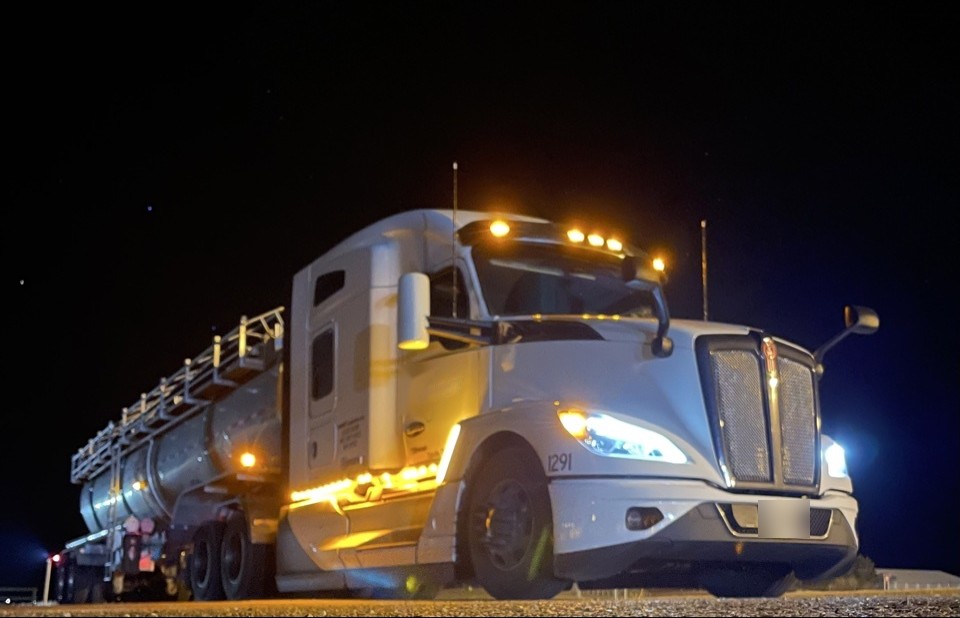 Roy Freight Systems Kenworth truck at night